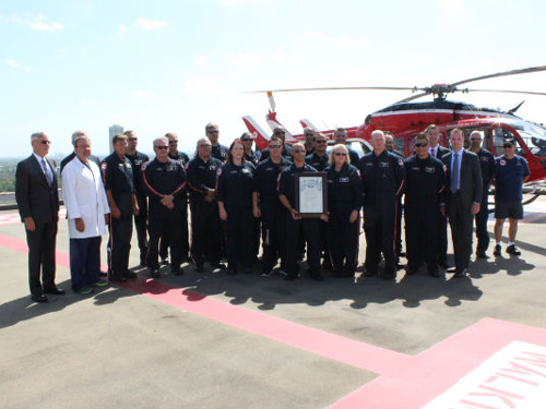 Life Flight 40th anniversary ceremony in front of helicopter